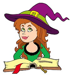 Image showing Cute girl witch reading book