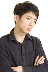 Image showing asia man in thinking pose isolated on a white background. 