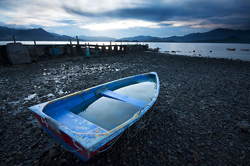 Image showing Old fish-boat on beach. 