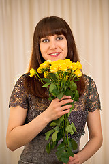 Image showing Woman with bunch of roses