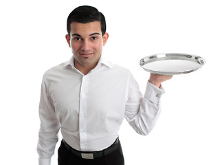 Image showing Waiter or bartender holding a silver tray