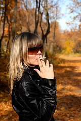 Image showing young girl with cigarette