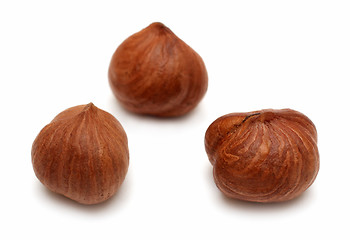 Image showing three clear hazelnuts