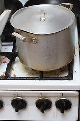 Image showing pan on old dirty gas stove