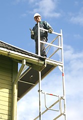 Image showing Man on the roof