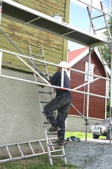 Image showing Man in a ladder