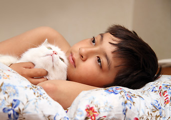 Image showing boy with white cat