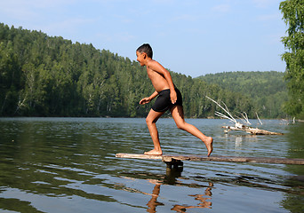 Image showing happy asian boy diving in lake