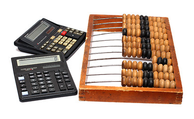 Image showing old abacus and two calculators