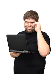 Image showing man standing with laptop