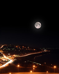 Image showing moon over night roads and embankment