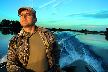 Image showing fishing men at dawn looking into the distance