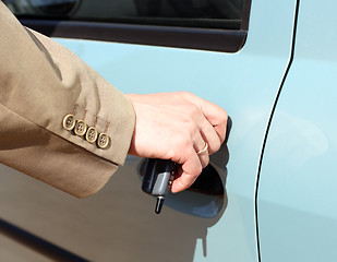 Image showing men hand open car door 