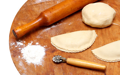 Image showing rolling-pin with patty and pastry