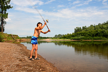 Image showing boy fishing with spinning