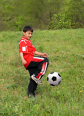 Image showing asian boy playing football