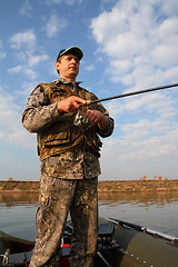 Image showing boy fishing with spinning