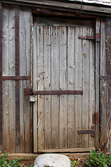 Image showing closed wooden door of old shed