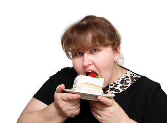 Image showing overweight woman biting cake