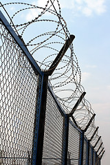Image showing fence with barbed wire