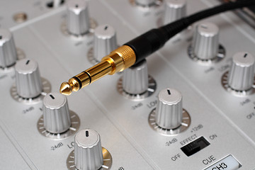 Image showing gold plug on dj music mixer
