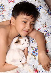 Image showing happy boy with cats