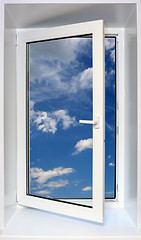 Image showing view on blue sky through open plastic window