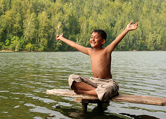 Image showing happy asian boy with hands up