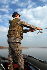 Image showing man fishing with spinning