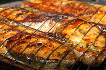 Image showing Salmon cooking on grill