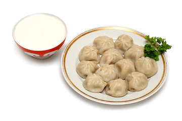 Image showing russian ravioli (pelmeni) with sour cream