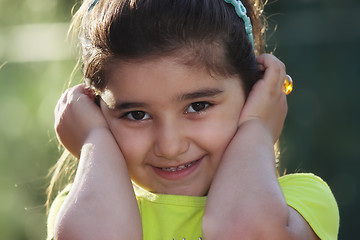 Image showing Little girl closing ears