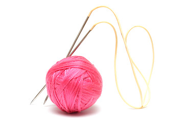 Image showing Pink clew with knitting needles isolated on white