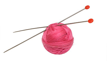Image showing Pink clew and knitting needles isolated on white