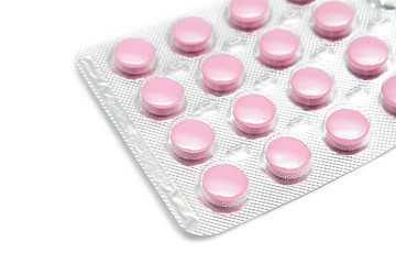 Image showing Pink pills on white background