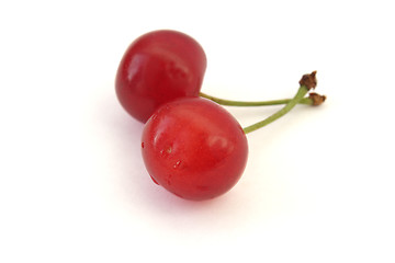 Image showing Two ripe cherries isolated on white