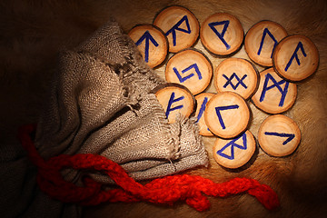 Image showing Runes with pouch in the dark
