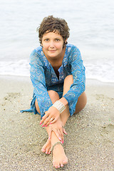 Image showing woman in blue dress on the beach