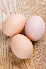 Image showing three brown eggs