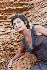 Image showing attractive brunet woman among rocks