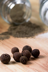 Image showing pepper on wooden background 