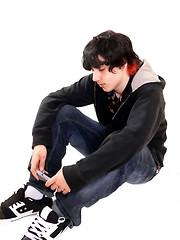Image showing Teen boy sitting  