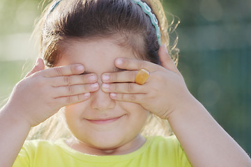 Image showing Little girl closing eyes