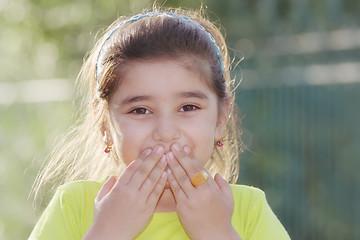 Image showing Little girl closing mouth