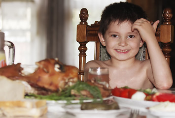 Image showing Little boy at table