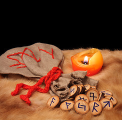 Image showing Runes, pouch and candle with copy space
