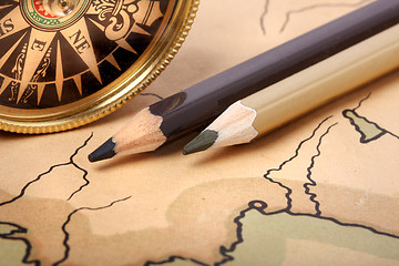 Image showing Compass and pencils on old map