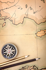 Image showing Compass and pencils on the map