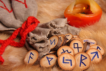 Image showing Runes with pouch and candle close-up