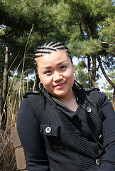 Image showing Beautiful Asian girl with braids